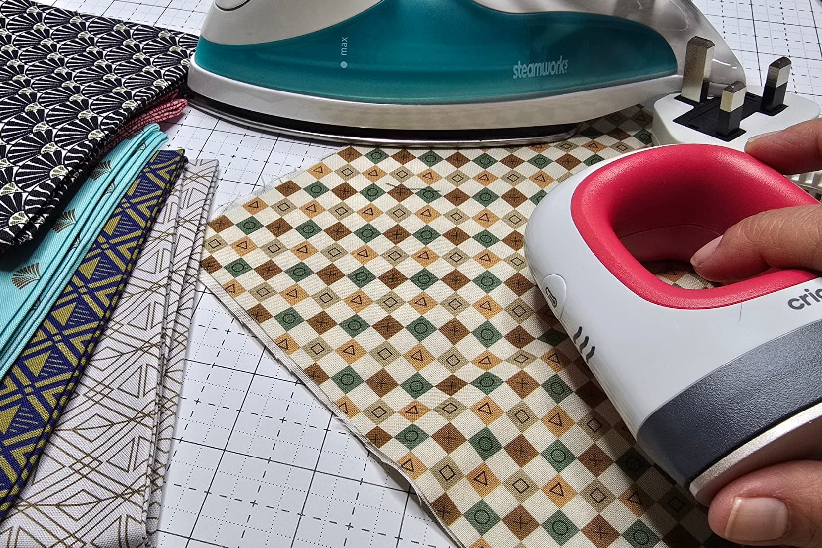 Beth is showing fabric with her small press iron she commoly used