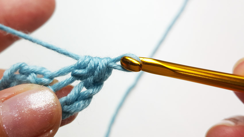 Yarn over for half double crochet